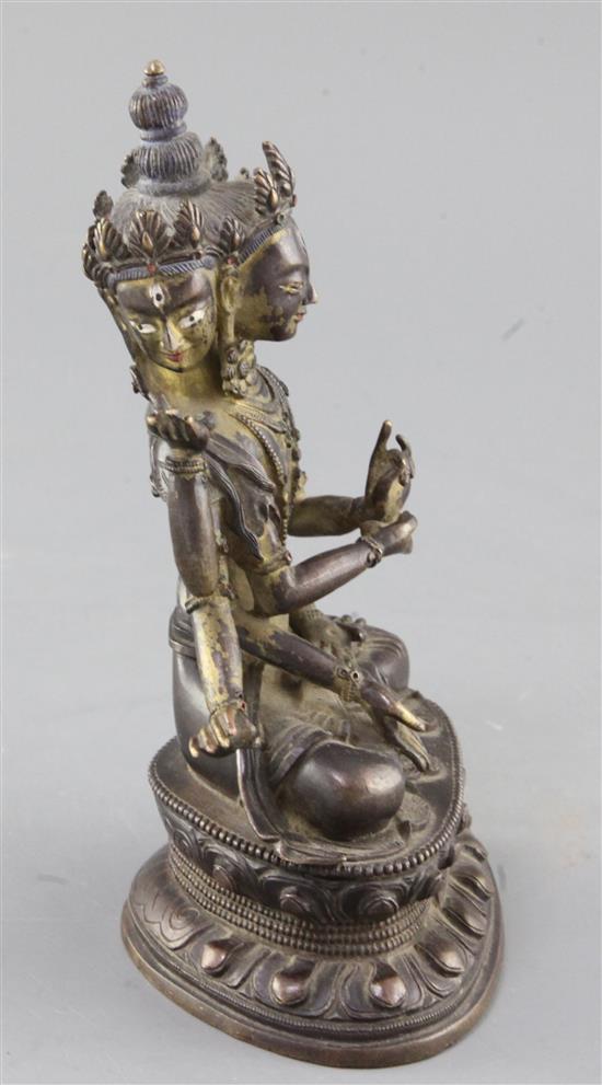 A Sino-Tibetan parcel gilt bronze seated figure of Avalokiteshvara, 18cm